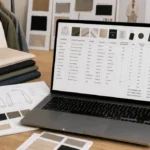 Fashion bill of materials with fabric swatches and tablet showing BOM table