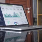 Apparel brand operations team reviewing fashion ERP software dashboard